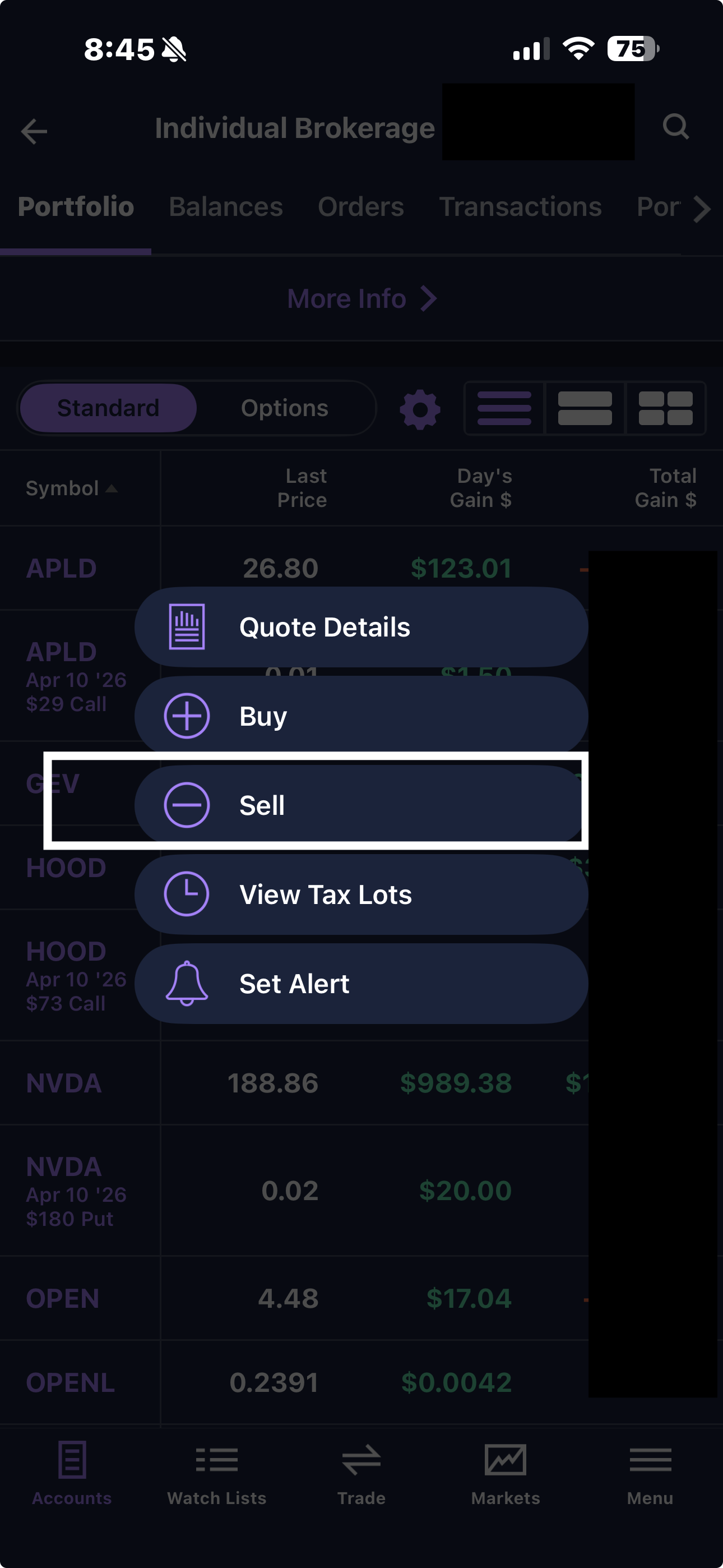 E*TRADE action menu showing Quote Details, Buy, Sell, View Tax Lots, and Set Alert